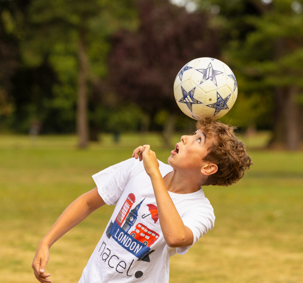 Student playing soccer