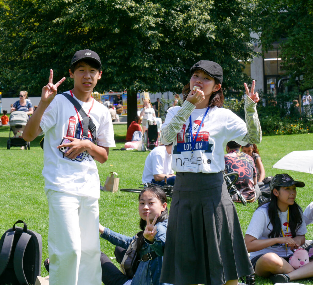Teen relaxing in the park in London during an excursion