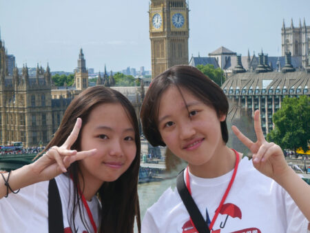 London summer camp - Teens taking pictures in front of Big Ben during summer camp