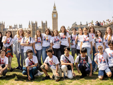 summer English camp London - Teens taking pictures in front of Big Ben during summer camp